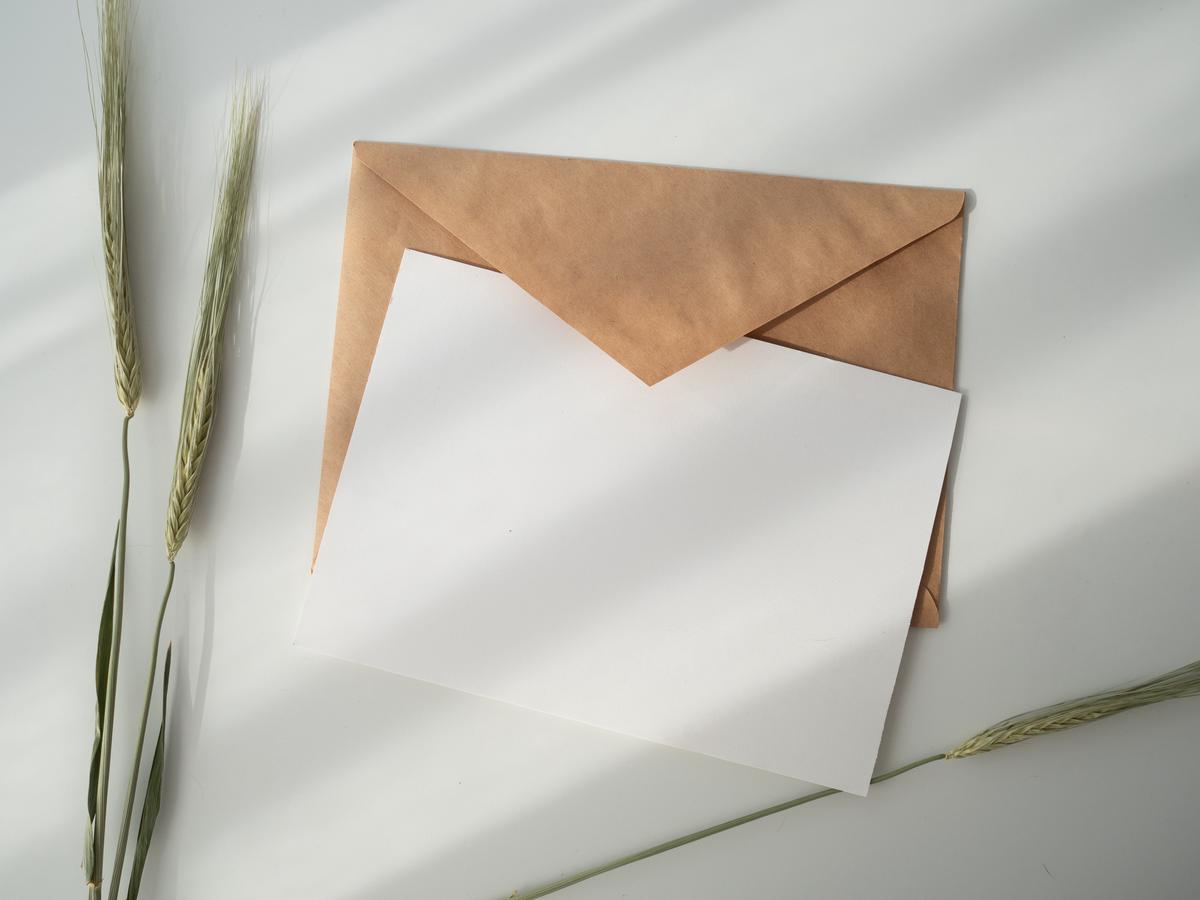Illustration of a person holding a letter, representing fan mail etiquette guidelines.